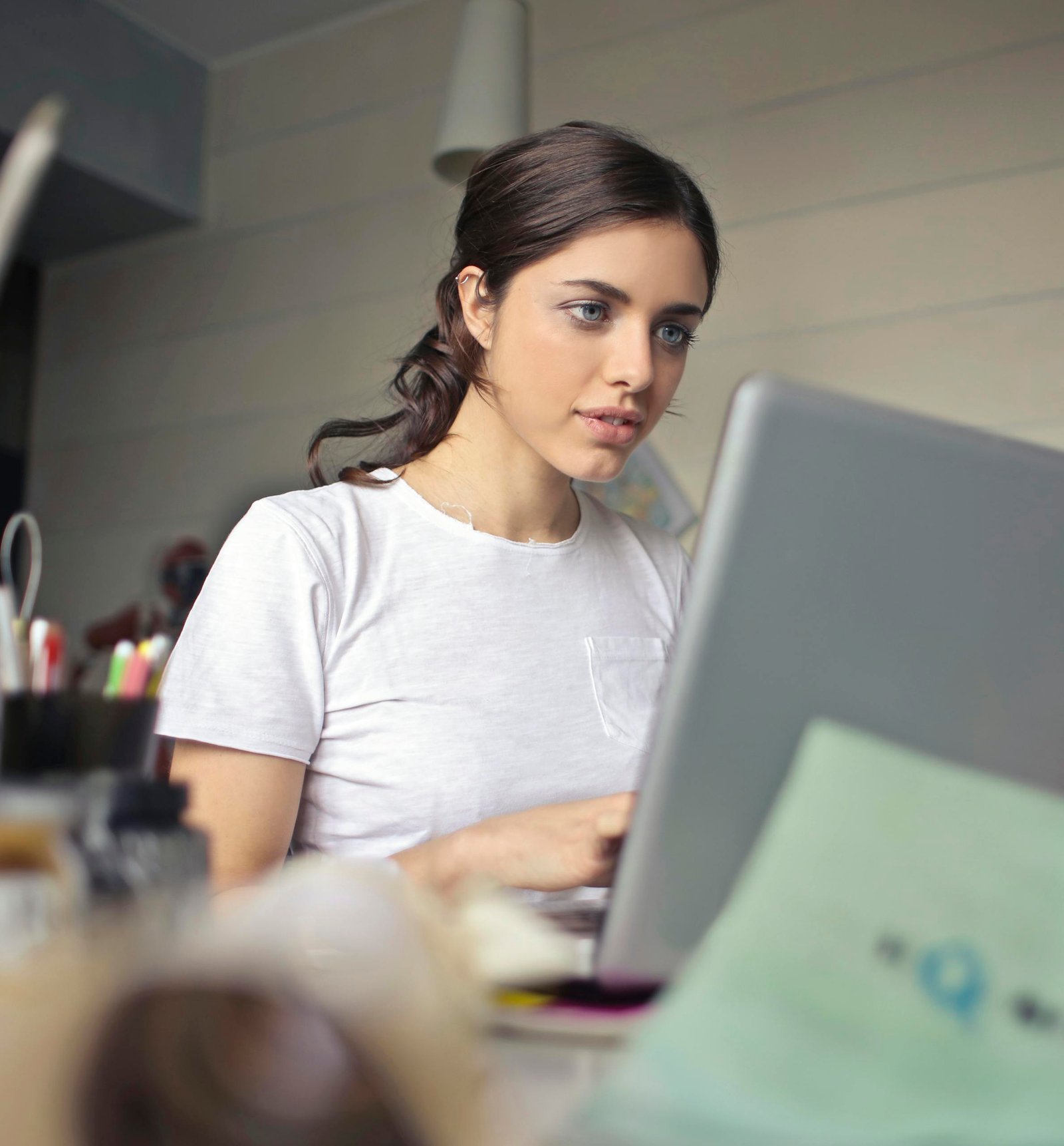 Young woman look at homepage design built using an automatic website creator tool