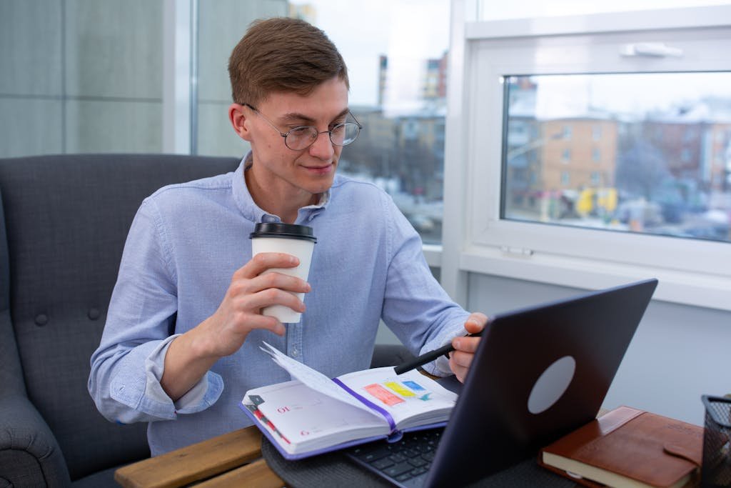 Business professional sipping coffee while thinking about how to monetize a blog