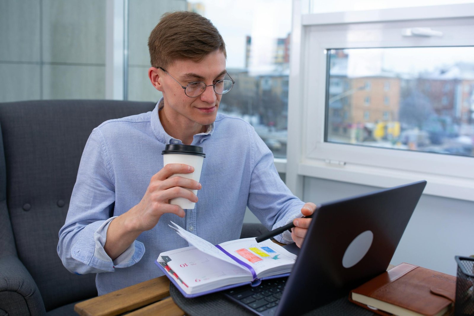 Business professional sipping coffee while thinking about how to monetize a blog